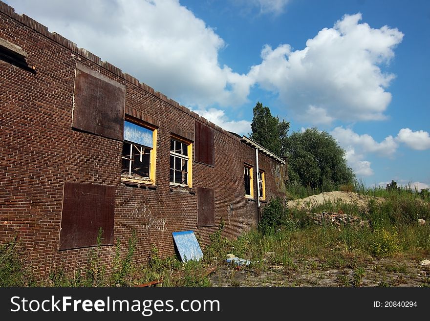 Old abandoned house over blue sky