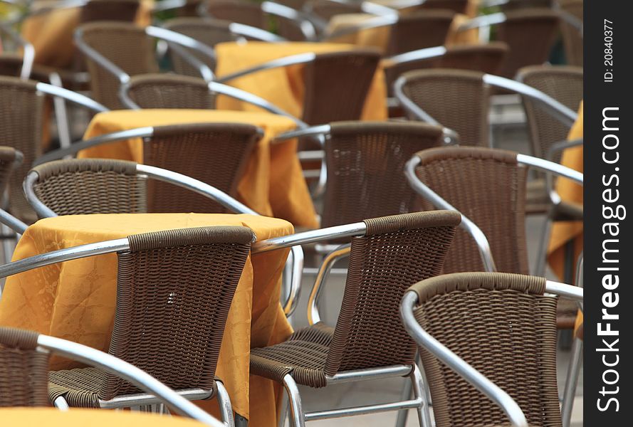 Close up image of many tables on a terrace.