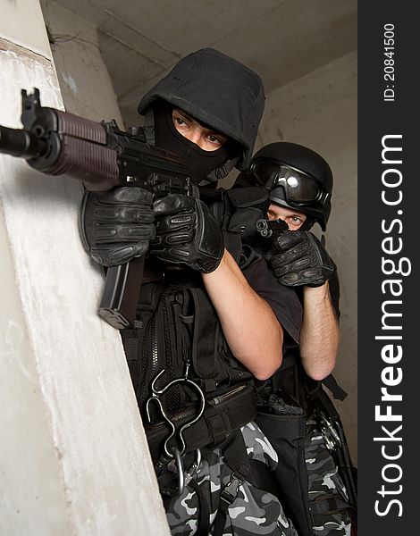 Photo of armed men in combat uniform playing terrorist or special forces team members. Photo of armed men in combat uniform playing terrorist or special forces team members