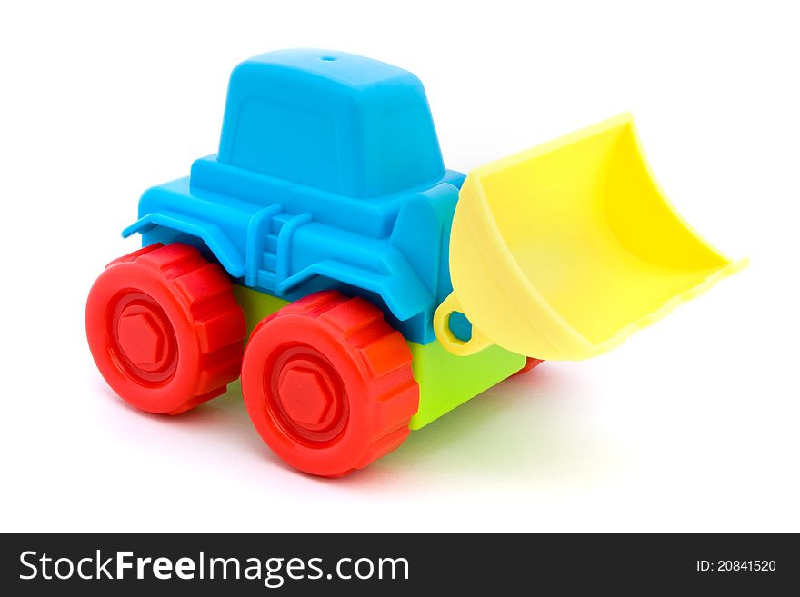 Colorful toy tractor isolated on a white. Colorful toy tractor isolated on a white