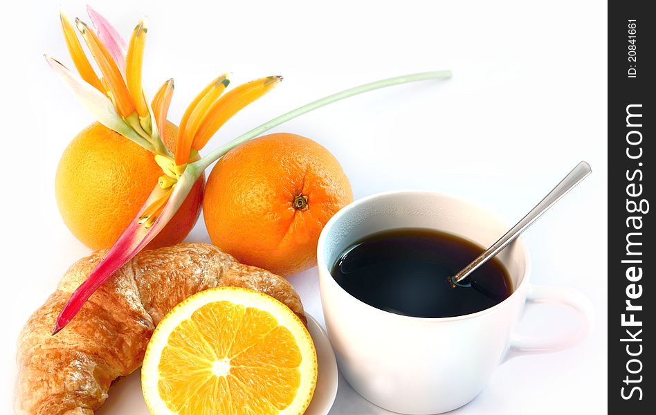 Hot coffee and croissants, orange decorate with flower. Hot coffee and croissants, orange decorate with flower