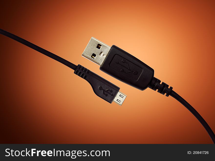 USB Cable On Orange Background