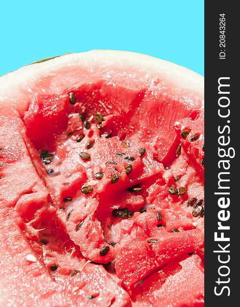 Section of watermelon on blue background