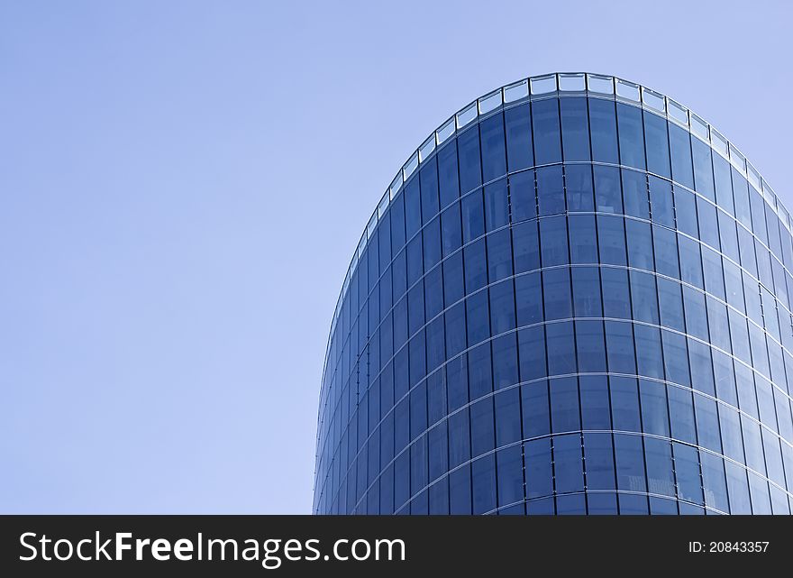 Skyscraper glass windows with a curved roof top. Skyscraper glass windows with a curved roof top