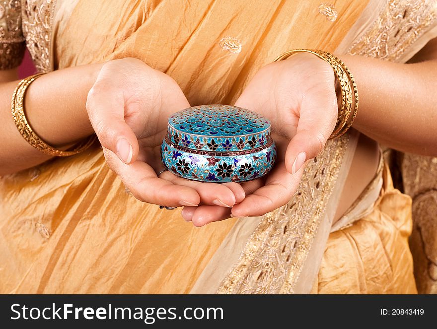 Indian casket in female hands