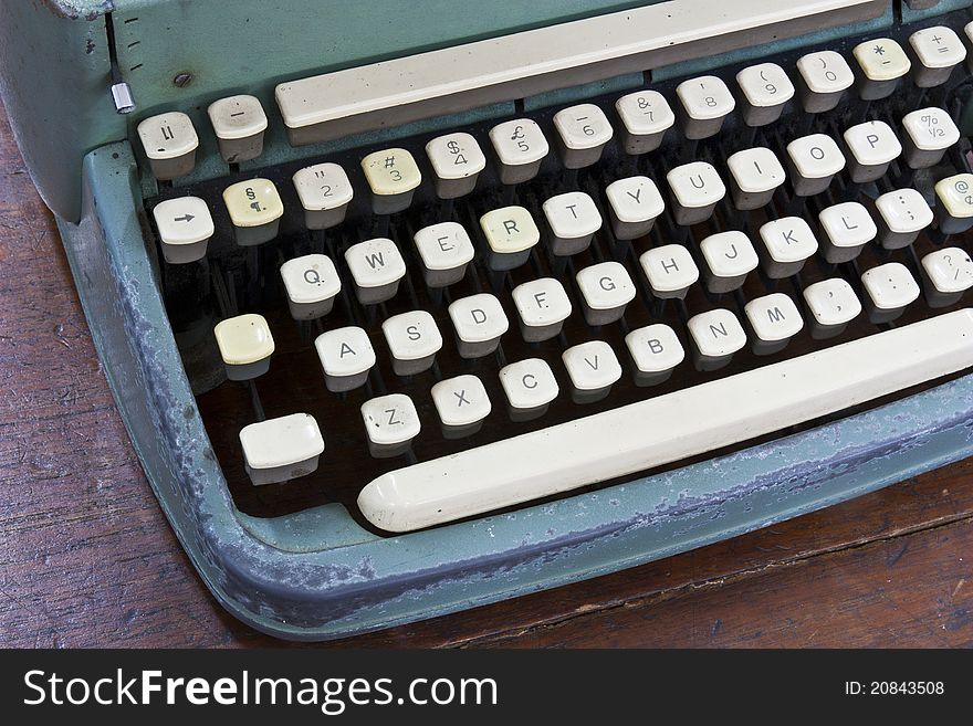 Old type device keyboard on old wooden table