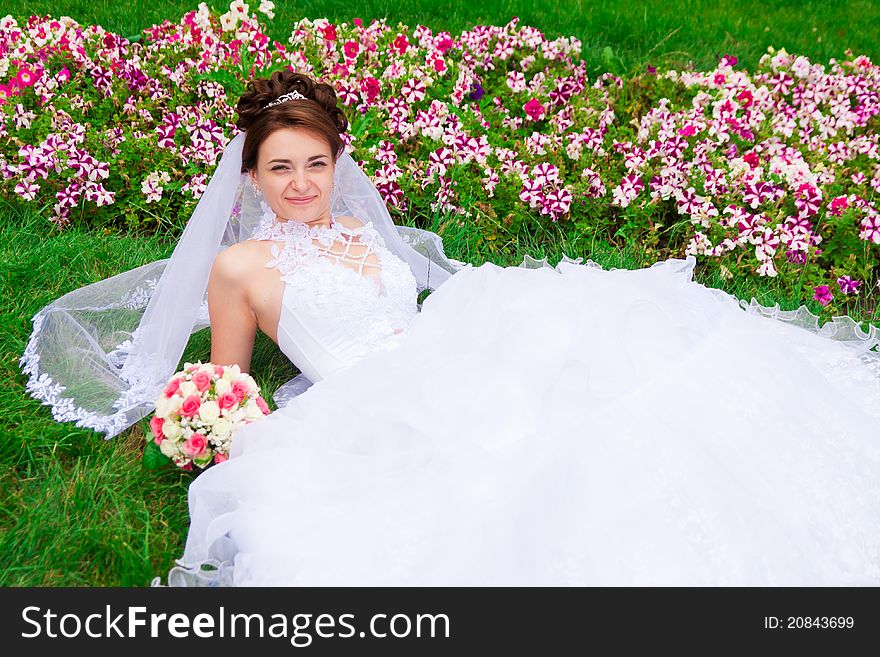 Portrait of a beautiful bride on the grass