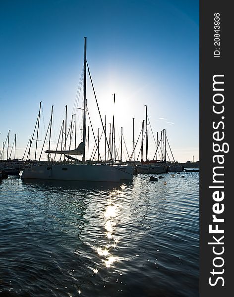 Yachts on an anchor in harbor, boats series