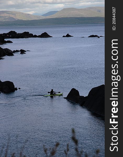 A lone kayaker on the coast of kerry in ireland