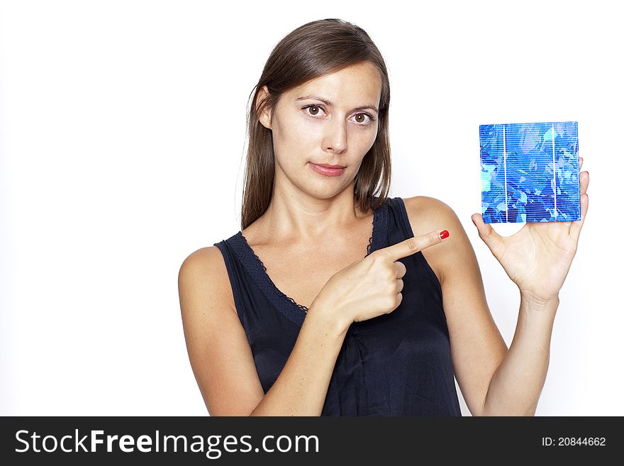 Woman Shows With Finger On A Solar Cell