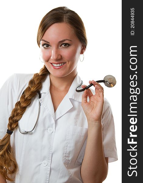 Girl doctor with long hair in a white coat with stethoscope isolated on a white background. Girl doctor with long hair in a white coat with stethoscope isolated on a white background