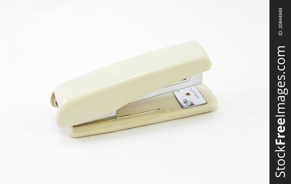 Plastic stapler on white background