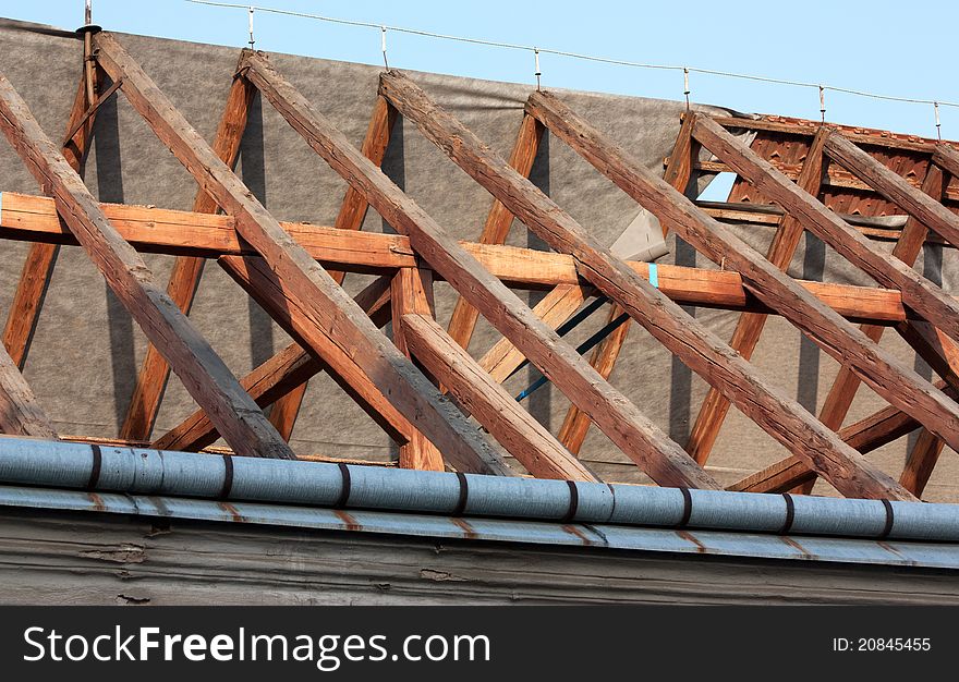 Frame roof renovation with exposed beams. Frame roof renovation with exposed beams