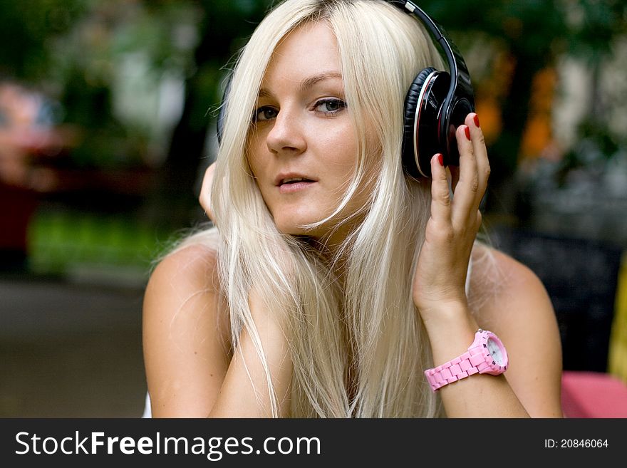 Closeup portrait of a girl with headphones