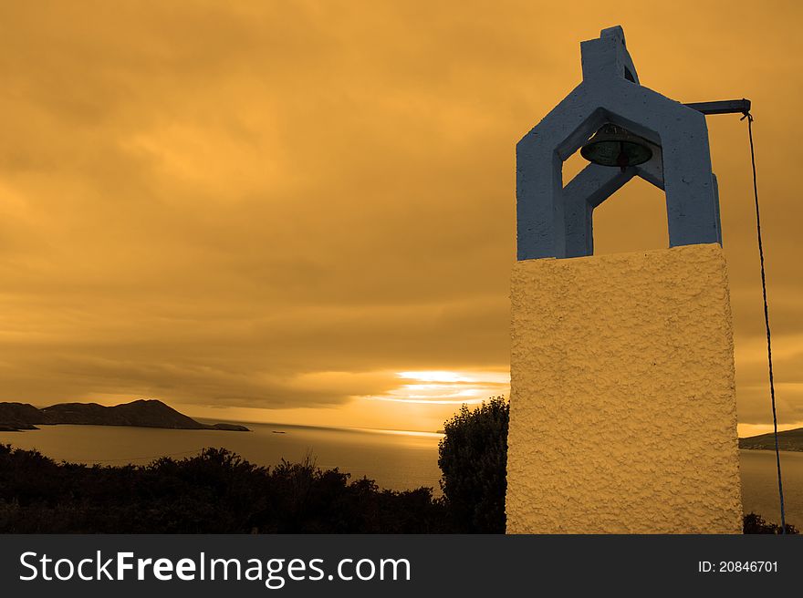 Bell tower at sunset with scenic view in kerry ireland of coastline