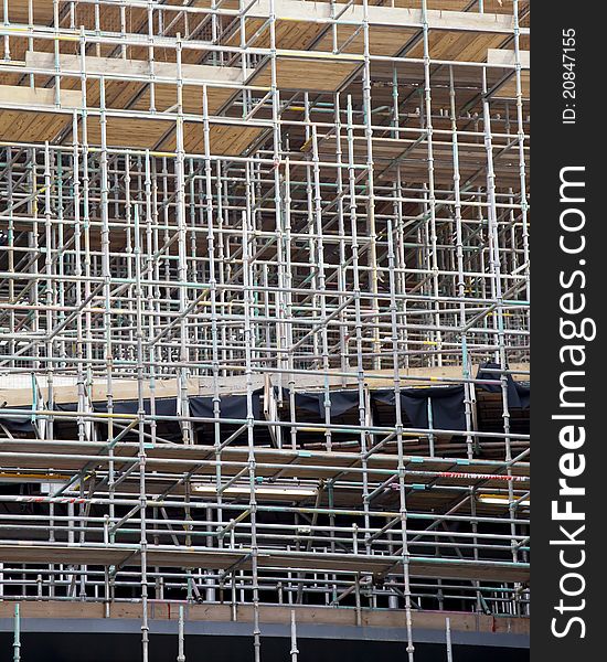 A lattice of scaffolding on a construction site