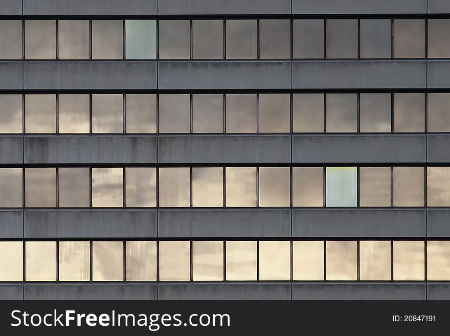 A pattern of windows in a modern office block