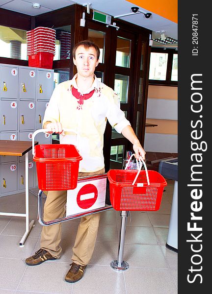 Man With A Basket In Market