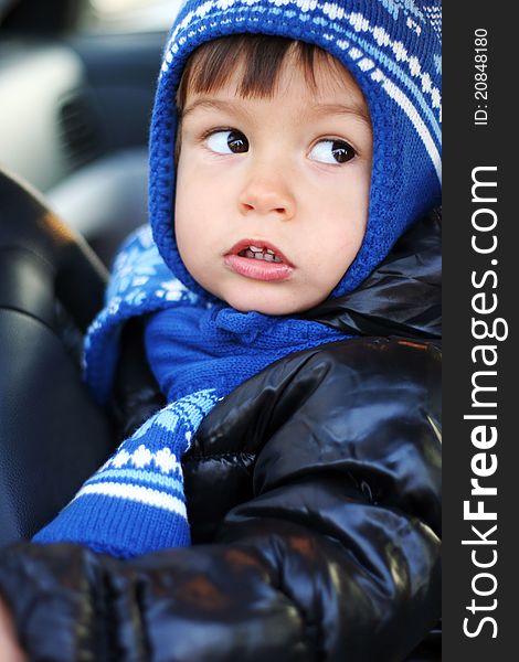 Beautiful little boy driving a car. Beautiful little boy driving a car