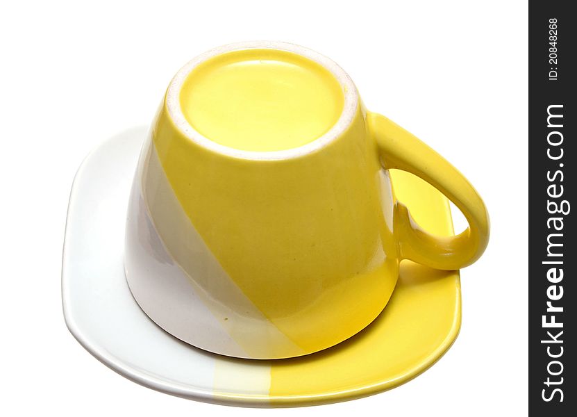 Yellow tea cup on a white background