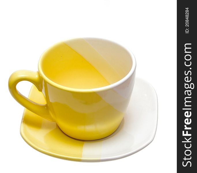 Yellow tea cup on a white background