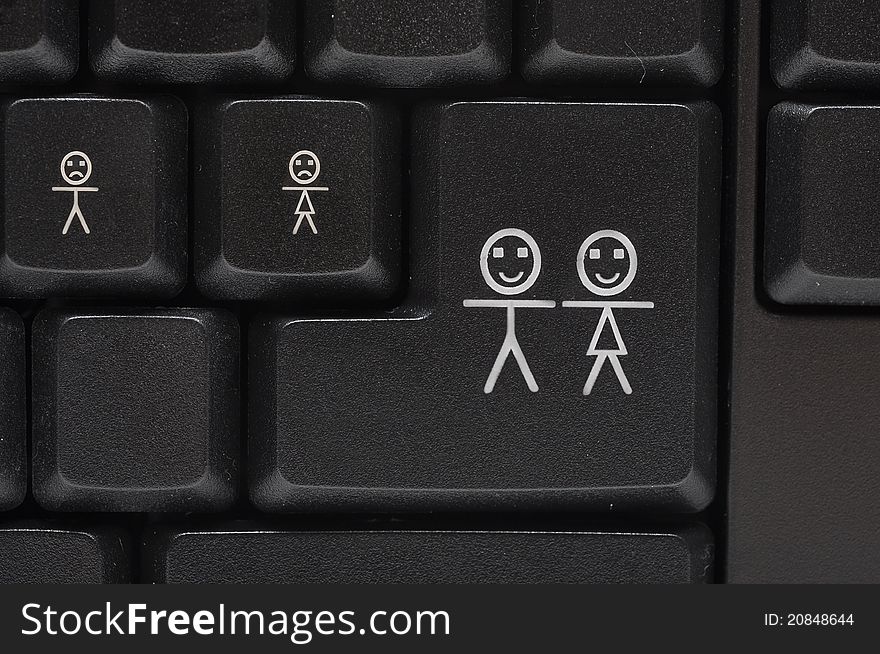 Black computer keyboard with smile key-happy family