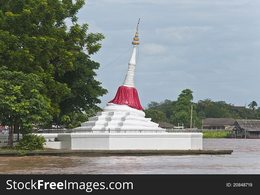 A white pagoda located at river side at nonthaburi province - Koh Kret, Thailand. A white pagoda located at river side at nonthaburi province - Koh Kret, Thailand