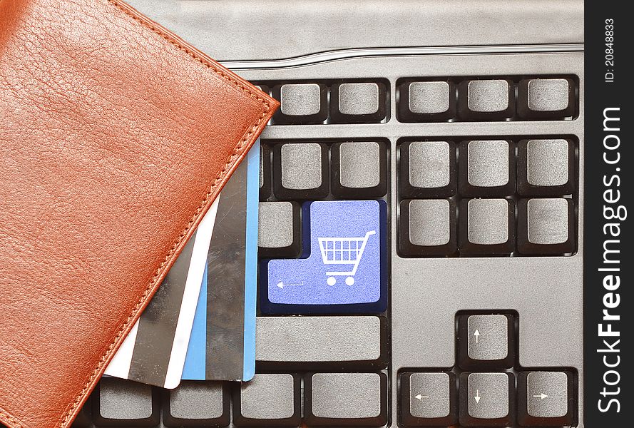 Keyboard computer button shopping cart. Online shop.