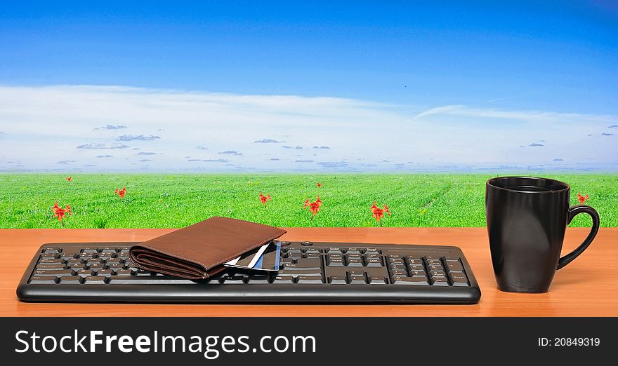 Keyboard on a table in the field. Business creativity concept