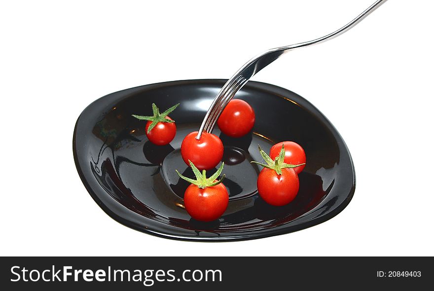 Tomatoes on the black plate