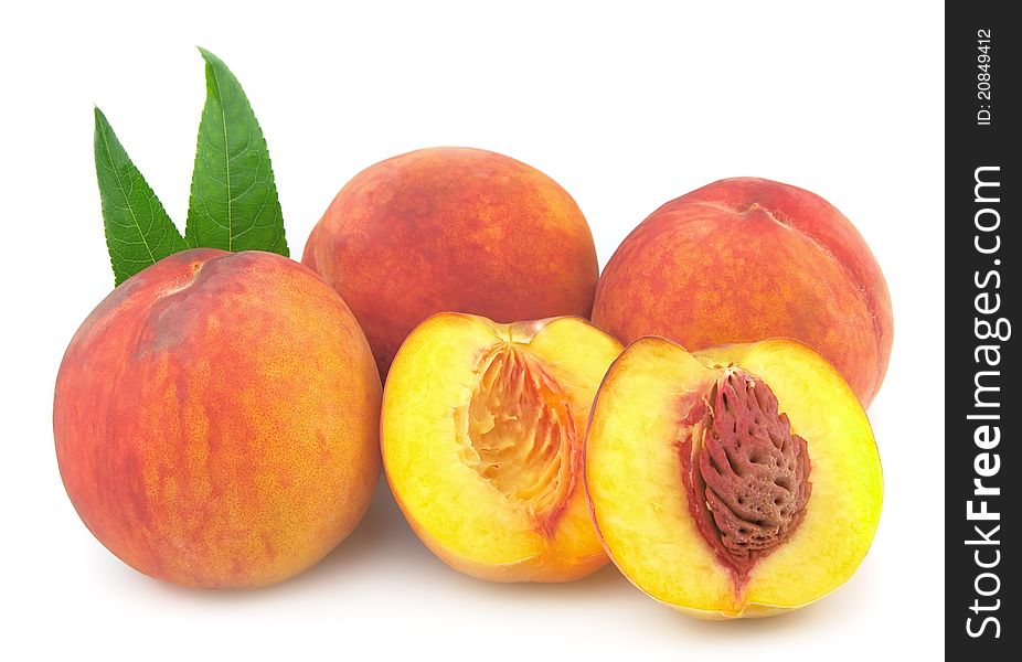 Ripe peaches on a white background