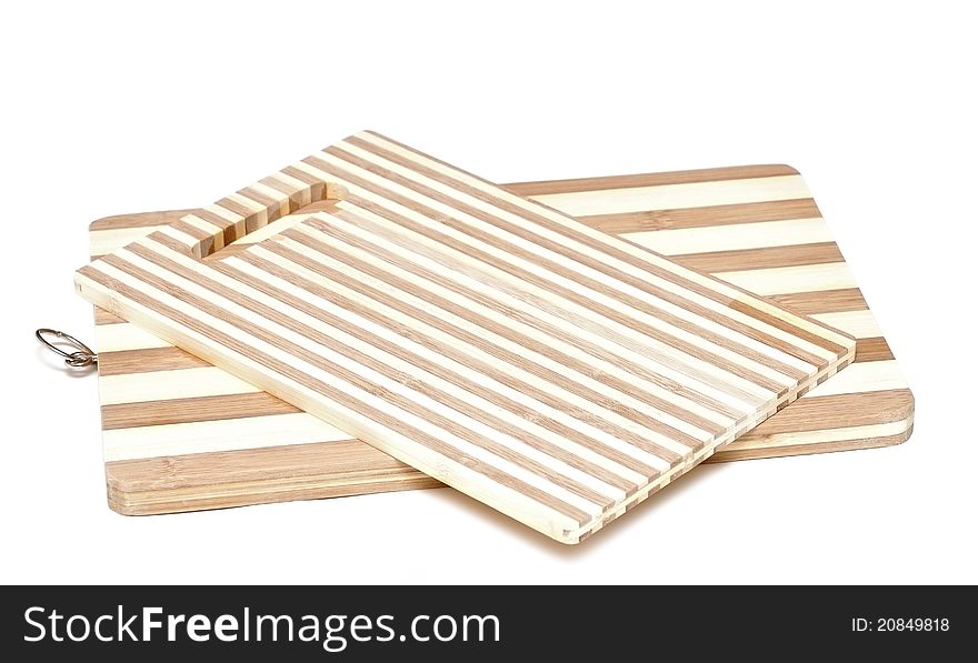 A wooden cutting board on a white background