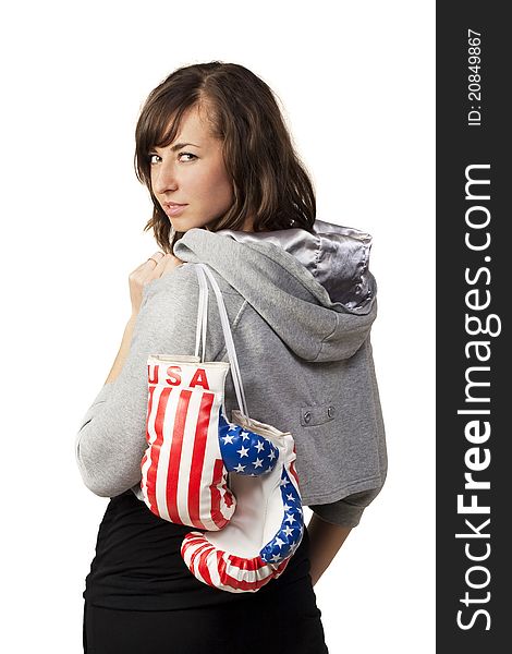 Girl posing for photo and holds boxing gloves. Girl posing for photo and holds boxing gloves