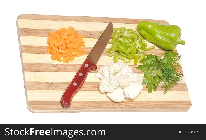 Still life of vegetables and kitchen-knife on cutting board