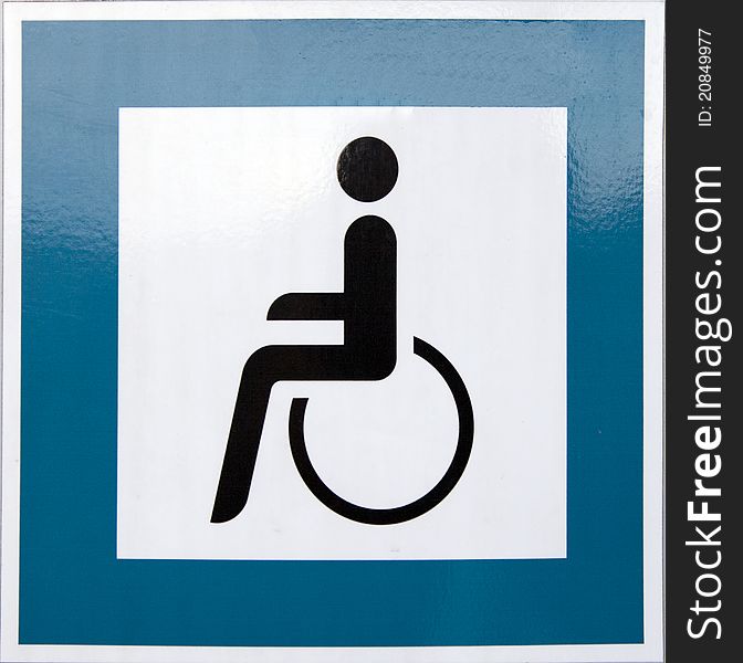 Blue square handicap sign with wheelchair