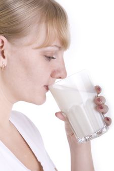 Young Blonde Girl Drinking A Milk Royalty Free Stock Photos