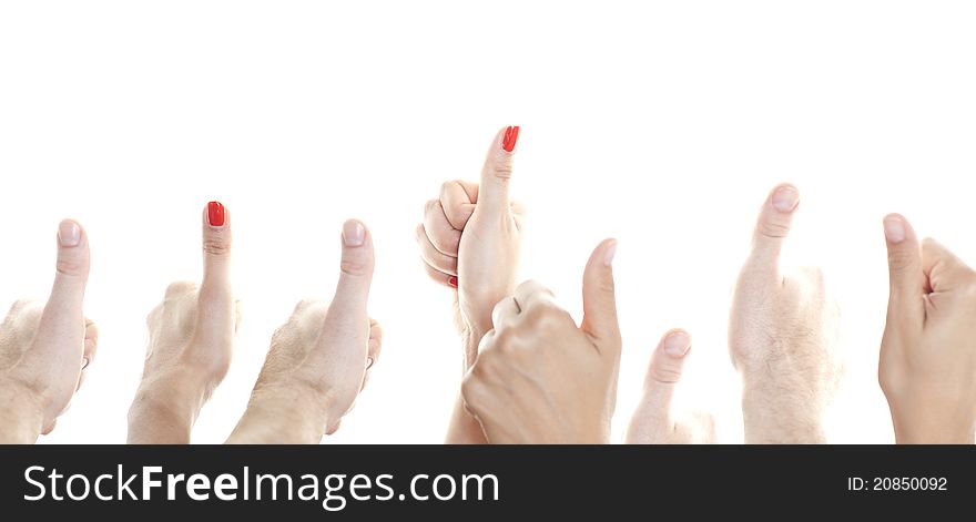 Many thumbs in front of a white background showing up