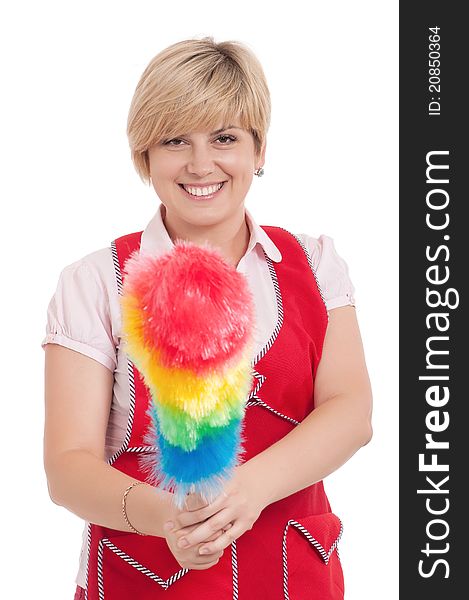 Happy young housewife holding duster - isolated on white background