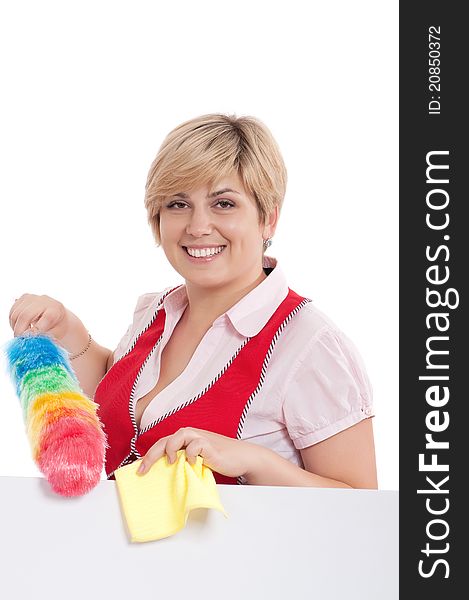 Happy young housewife holding duster - isolated on white background