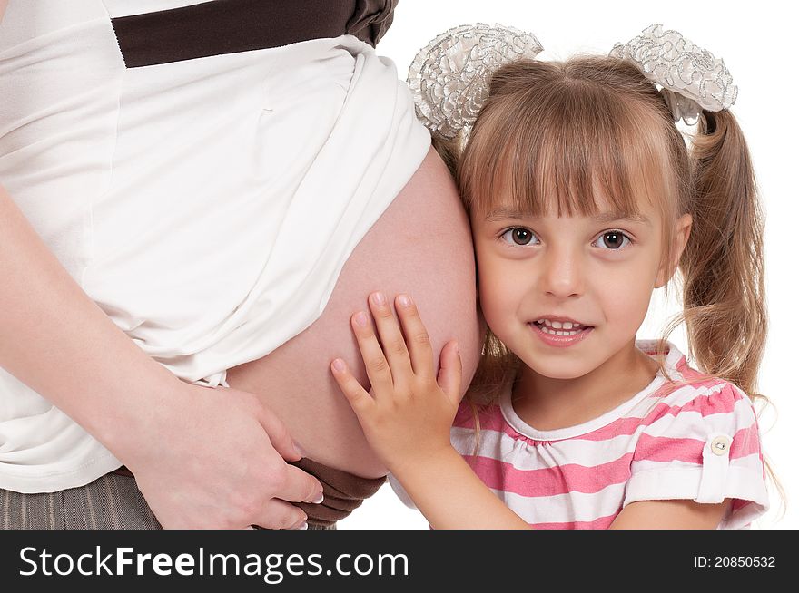 Pregnant women with her daughter - isolated over a white background. Third trimester. Pregnant women with her daughter - isolated over a white background. Third trimester.