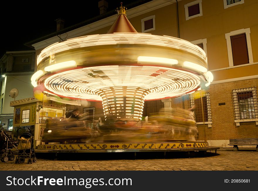 Night shot of a spinning carousel