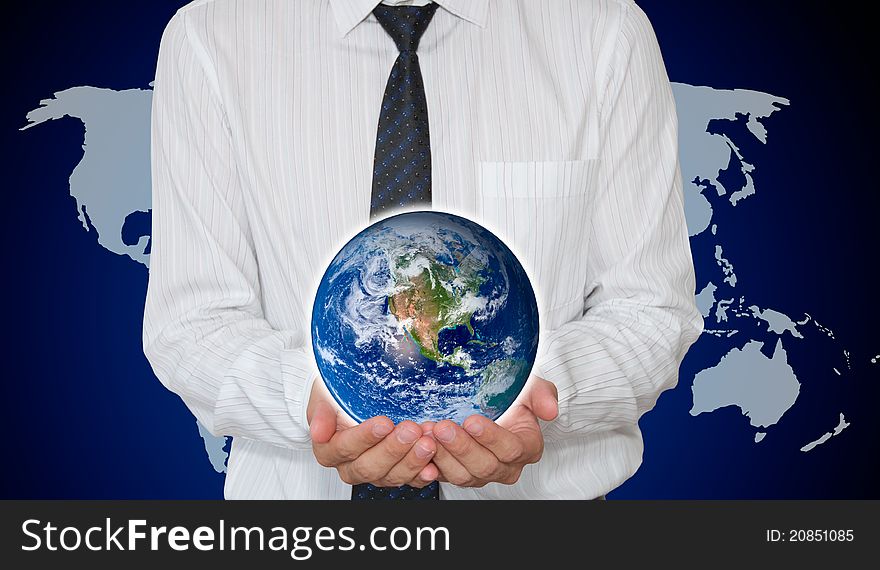 Businessman holding Planet earth with world map in background