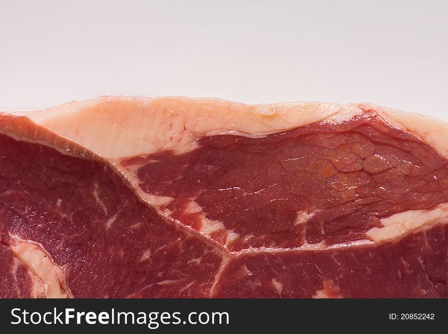 Fresh and raw beef steak on white background