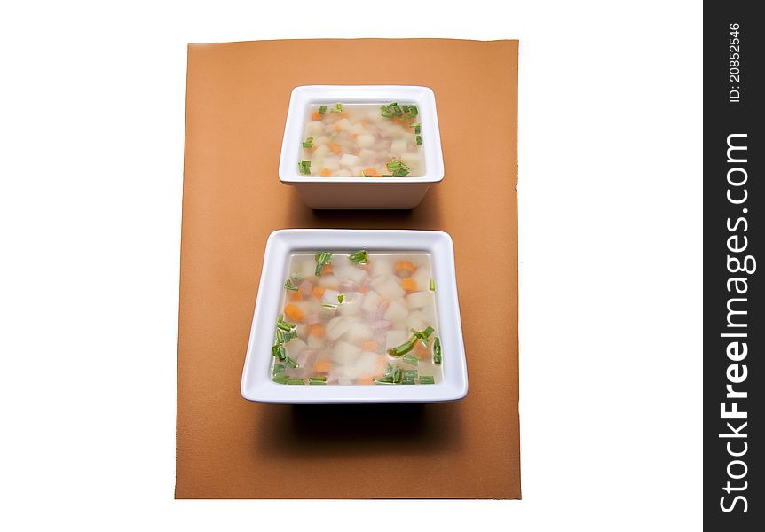 Two Square Bowls Of Soup.