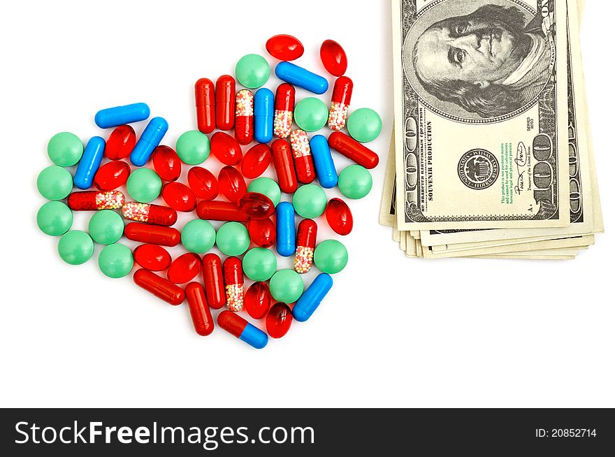 Colorful tablets with capsules isolated on white background