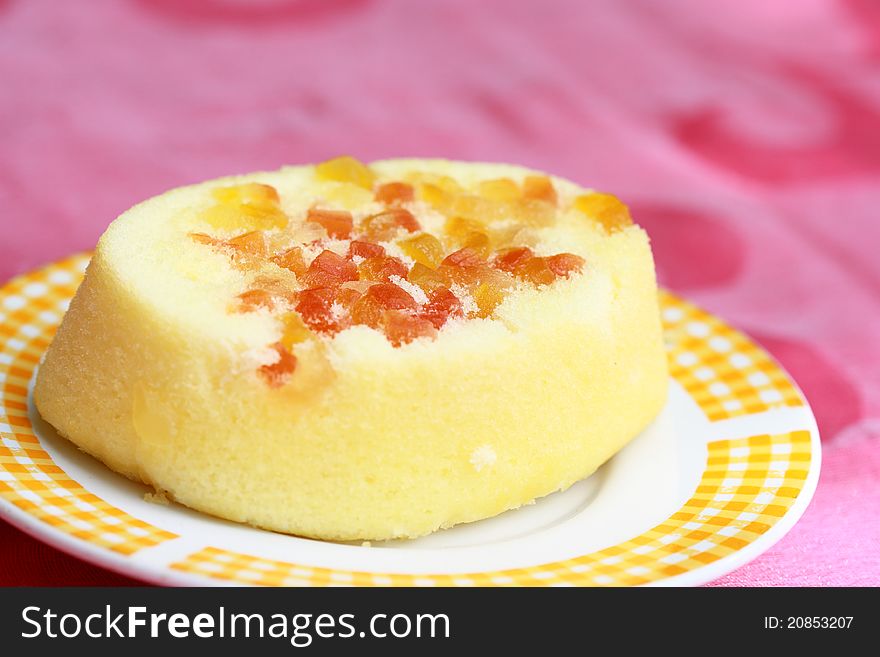 Plate with fruit cake in the morning light