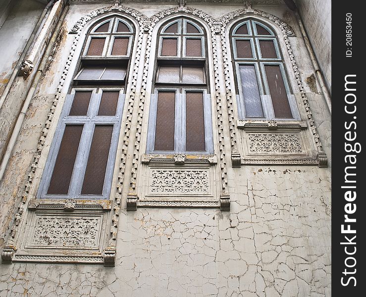 Three blue old windows