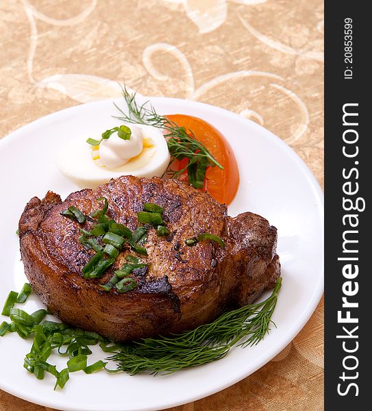 Delicious fried steak with herbs