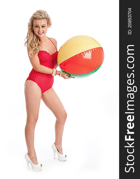 Pretty young female in red swimsuit and inflatable
