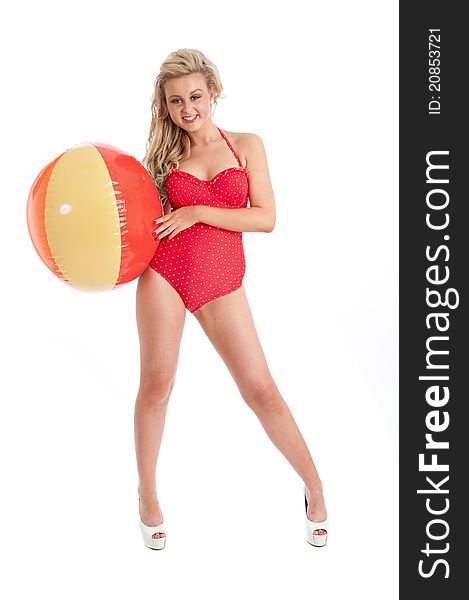 Pretty young female in red swimsuit and inflatable